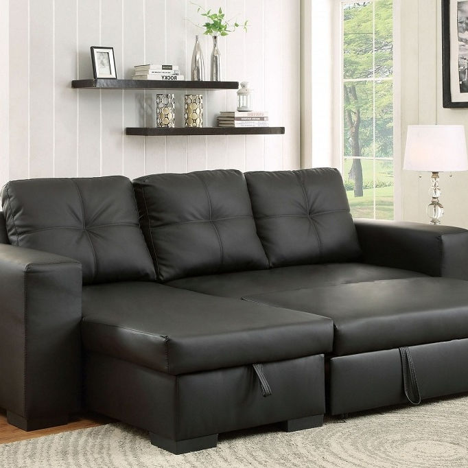 Sofabed Sectional With a Large Lift up Storage Compartment.  Reversible Left or Right Hand Chaise.  Black PU.