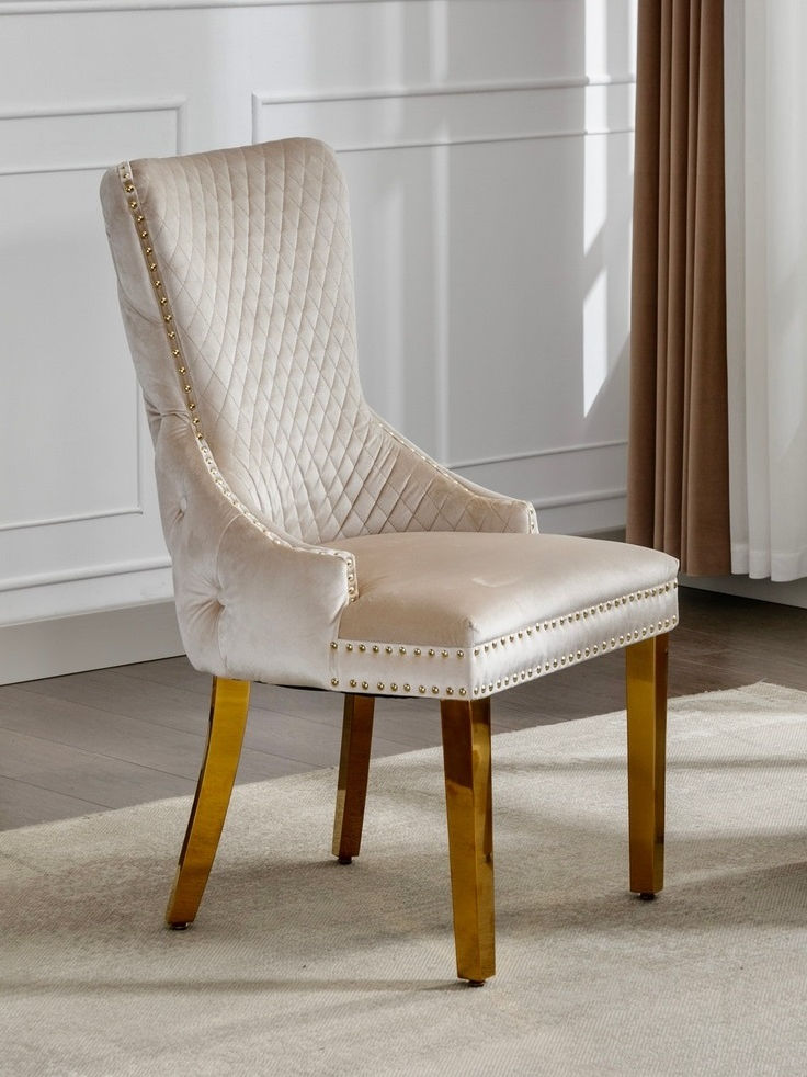 Creme Velvet Dining Chair with Large Knocker, Polished Gold Frame, Deep Tufting back and Nail Head Details. SET OF 2